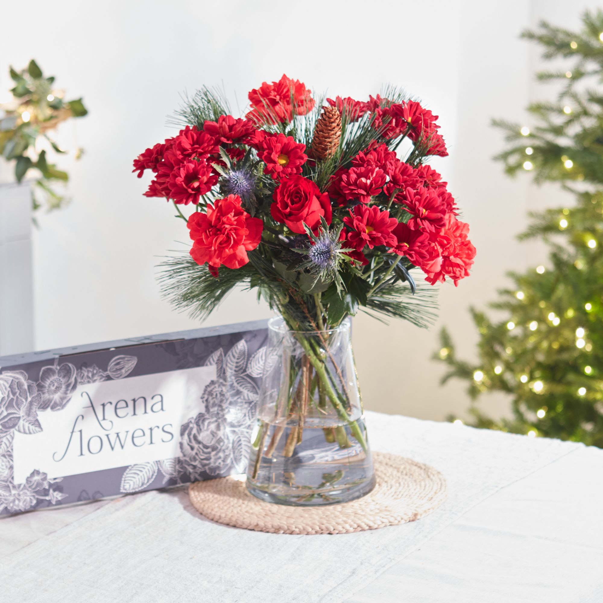 Send festive 'Jolly Red' letterbox Christmas flowers | Arena Flowers