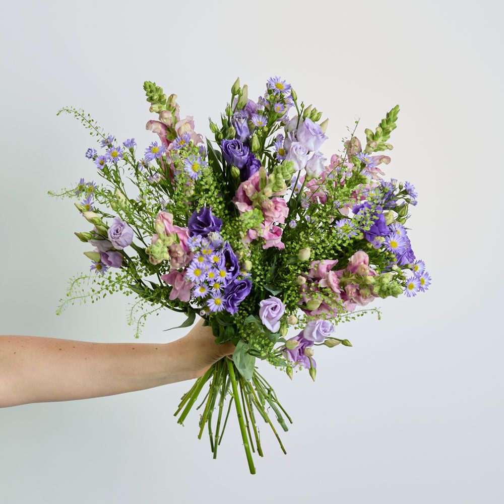 Purple asters, lisianthus, lavender and antirrhinum