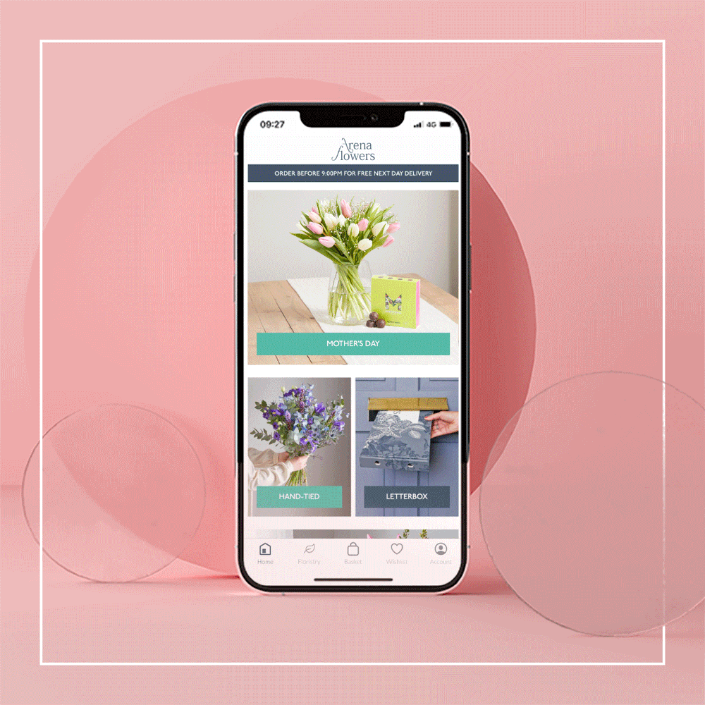 A GIF of a mobile phone on a pink background with abstract circles around it. The mobile phone's screen shows an app with bouquets for Mother's Day, product pages and the app's home screen.