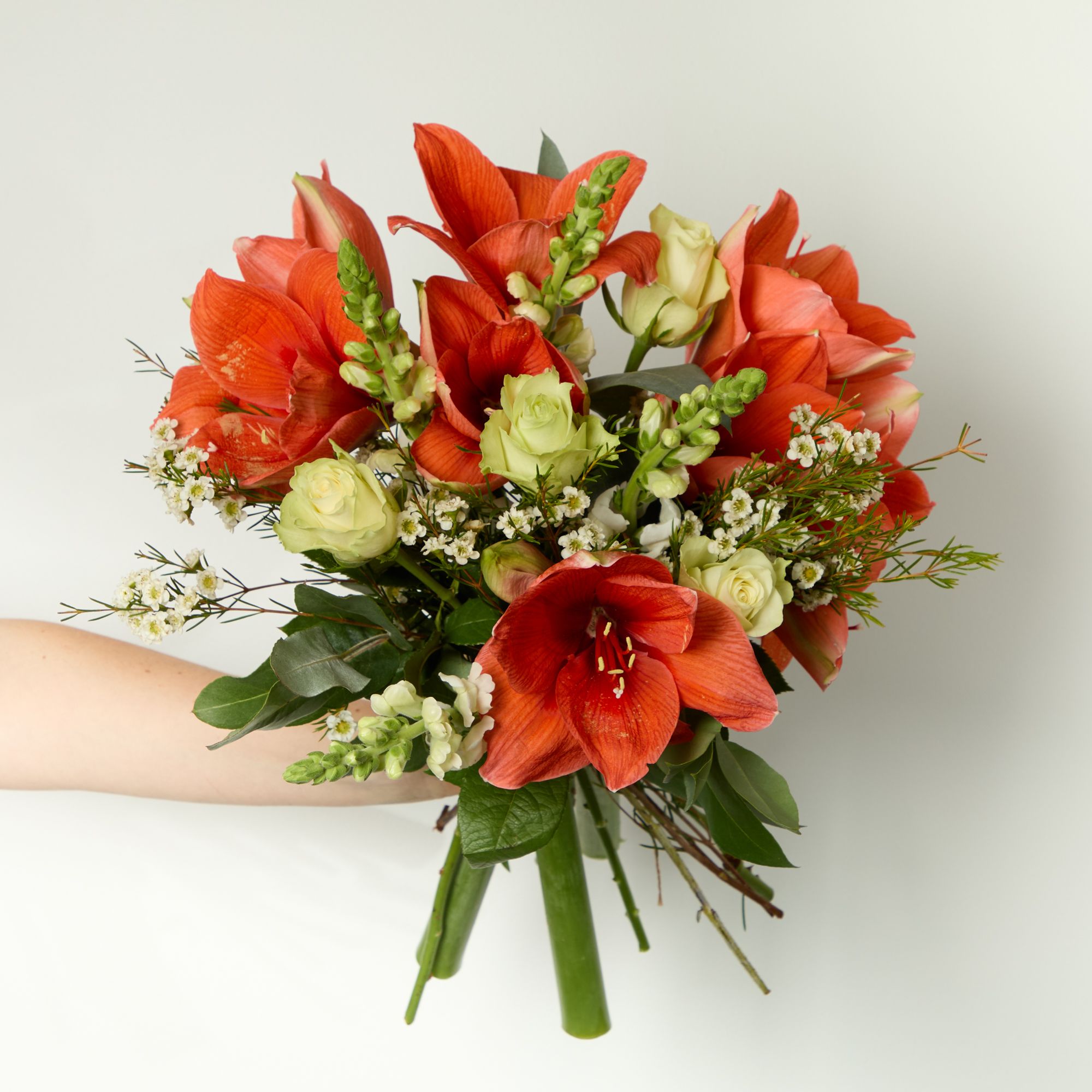 ‘Horizon’ amaryllis, white roses, white antirrhinum, white waxflowers, eucalyptus robusta